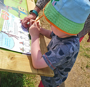 Taking part in the Stick Man Trail at National Memorial Aboretum, Staffordshire. Image courtesy Dirt, Diggers & Dinosaurs
