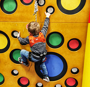 Boy climbing one of the indoor obstacles at Clip n Climb, Stone, Staffordshire. Image courtesy Dirt, Diggers & Dinosaurs