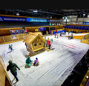 Playing in the real snow at the SnowDome, Tamworth, Staffordshire. Image courtesy Dirt, Diggers & Dinosaurs