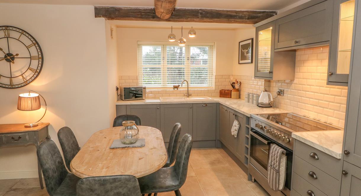The rustic kitchen/dining area at Orchard Barn