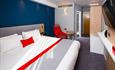 One of the comfortable, modern bedrooms