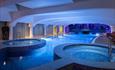 The soothing jacuzzis and saltwater pool, bathed in blue light