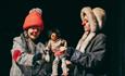 Artists performing with puppet